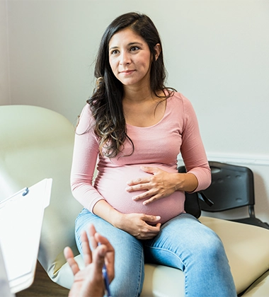 Chiropractic San Francisco CA Pregnant Woman Pregnant Woman In Doctors Office