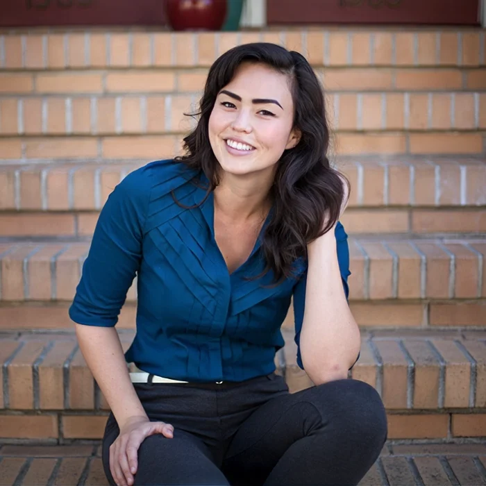 Chiropractor San Francisco CA Kate Russell Chiropractor Kate Russell Smiling On Brick Steps